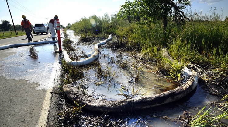 Booms being used to contain an oil spill at an Exxon Mobil site in NJ.