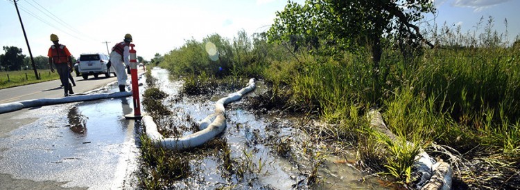 Booms being used to contain an oil spill at an Exxon Mobil site in NJ.